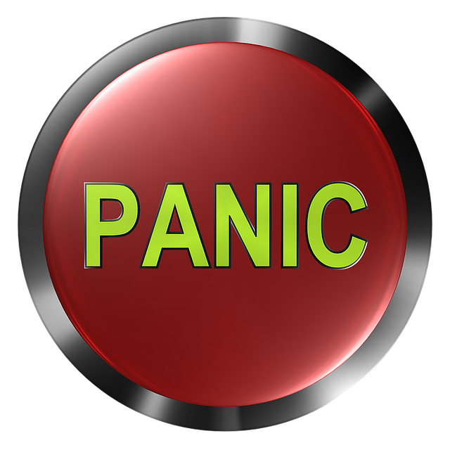 Red panic button with bold green text